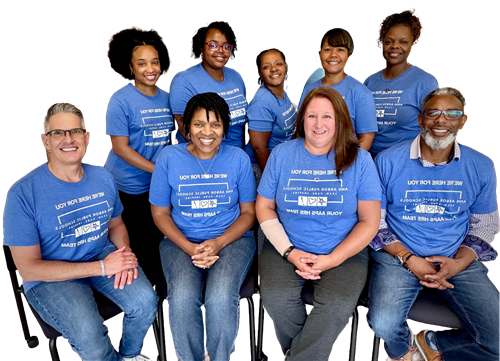 Members of the AAPS HR staff wearing matching blue shirts.